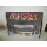 A boxed Atari 7800 video game system