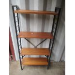 A mid 20th century Ladderax shelving unit consisting of two ladders, four teak shelves and eight