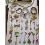Mixed costume jewellery, mainly pendants on chains to include silver examples and a sterling