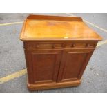 A Victorian satin wood cupboard having two drawers and a cupboard below, 101 h x 91cm w