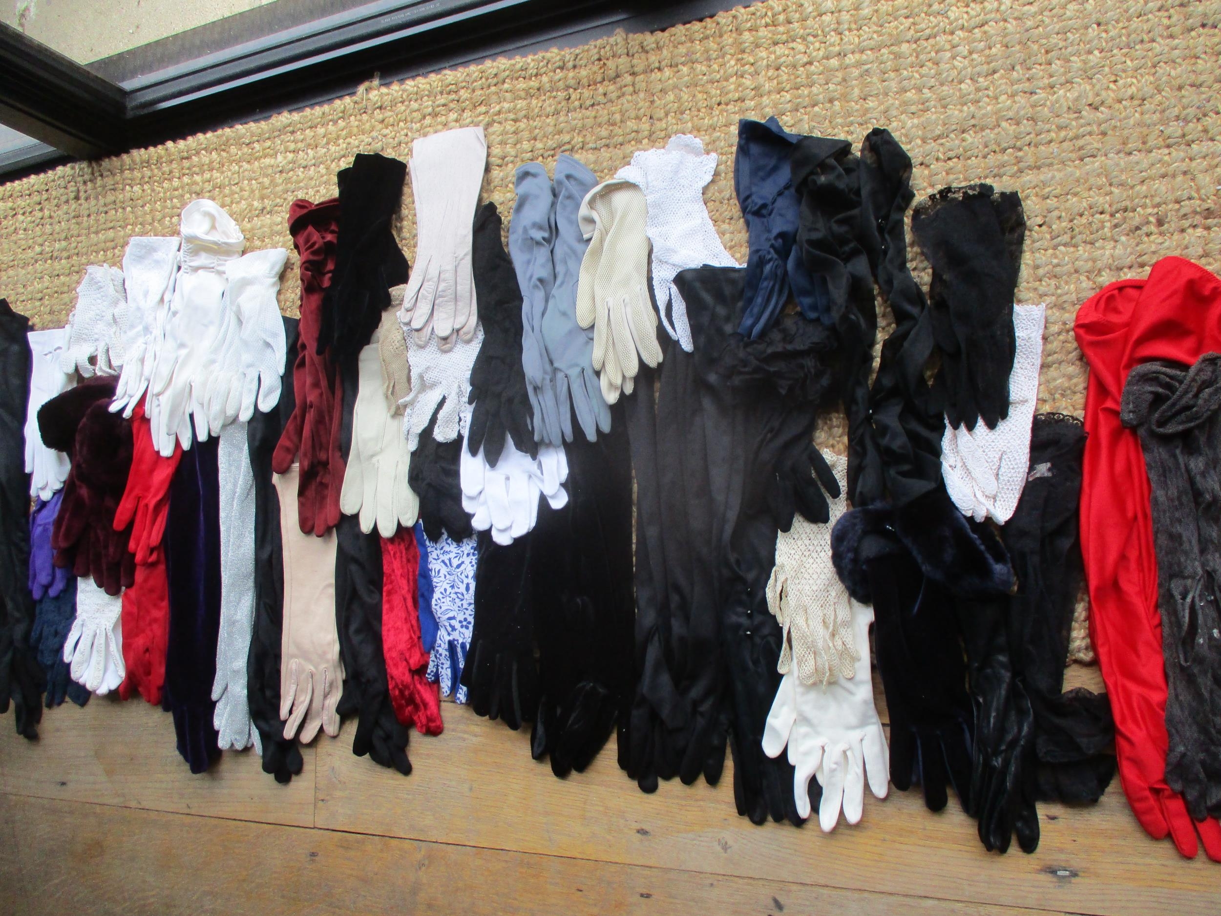 A large quantity of ladies gloves to include Dents, together with vintage scarves to include Ken