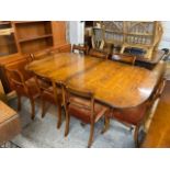 An Alfred Allen yew dining room extending table having three extra leaves 77cm h x 185cm w