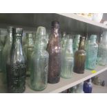 A selection of 19th century and later glass bottles to include advertising examples for Wheelers