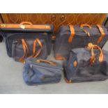 Five pieces of Italian Brics 'Lite' luggage items in a royal blue colour with brown leather straps