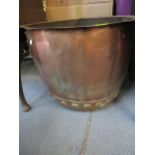 A copper copper/log basket with riveted decoration Location: A1