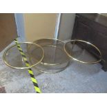 A vintage brass Milo Baughan style three tier swivel coffee table