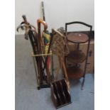 A mixed lot to include mixed walking sticks, some silver tipped examples with a stick stand together