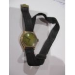 A ladies gold cased wristwatch, 9ct with ribbon bracelet, total weight 11.35g Location: CAB
