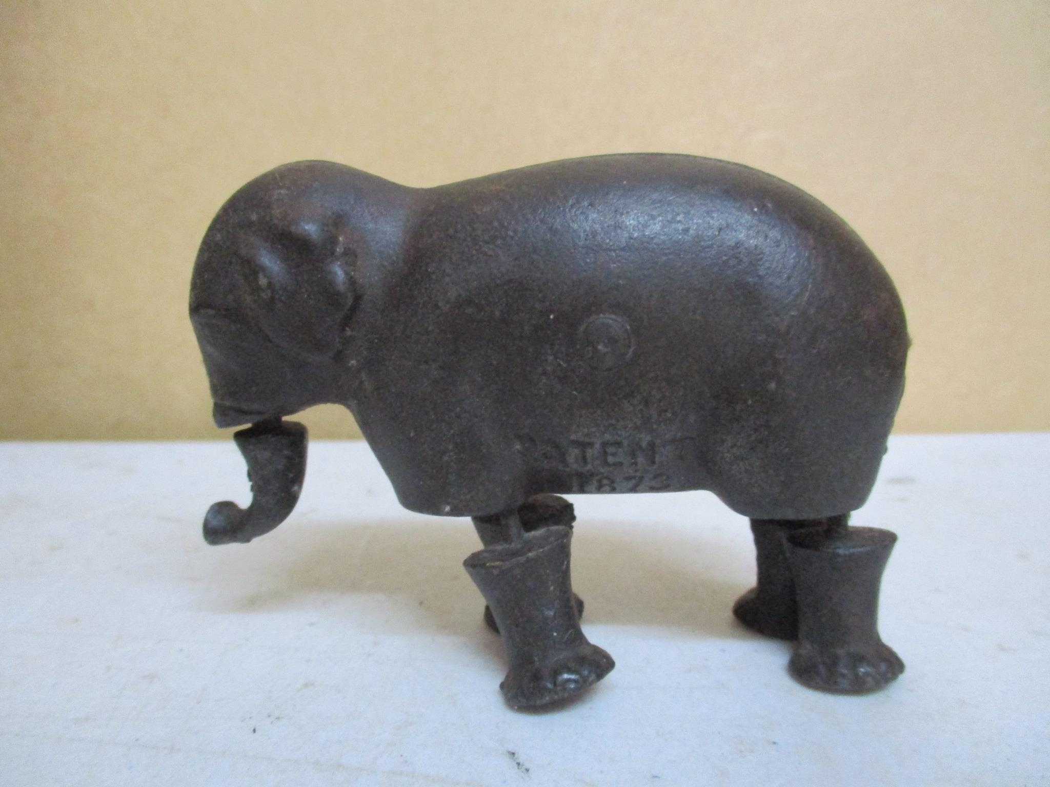 A Victorian IVE's cast iron ramp walking toy elephant, stamp marked patent 1873, made by the Ives
