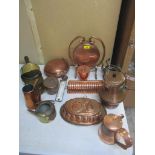 A mixed lot of copper and brass ware to include two ice cream makers, a copper gong, jelly moulds