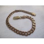 A 9ct gold flat curb link bracelet, 9.5g