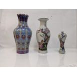 Three Chinese porcelain vases one with lobed floral ornament, 26cm high, a baluster vase with a bird