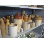 A selection of stoneware pots, jars and foot warmers, some advertising to include Summerfields