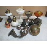 A quantity of Victorian oil lamp bases, wall brackets, burners and other parts