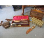 A vintage horn handled carving set in mahogany case, a marquetry games box and other treen items,