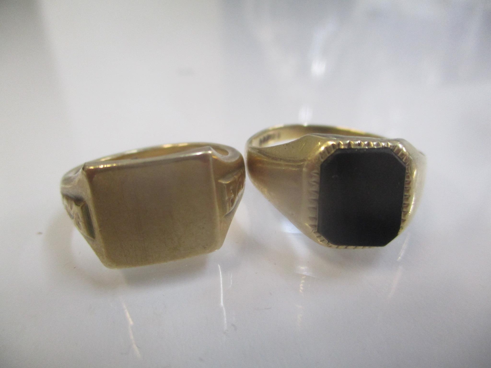 Two 9ct gold gents signet rings, one set with a black tablet, 8.8g