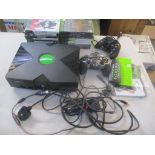 An Xbox console together with accessories and mixed games