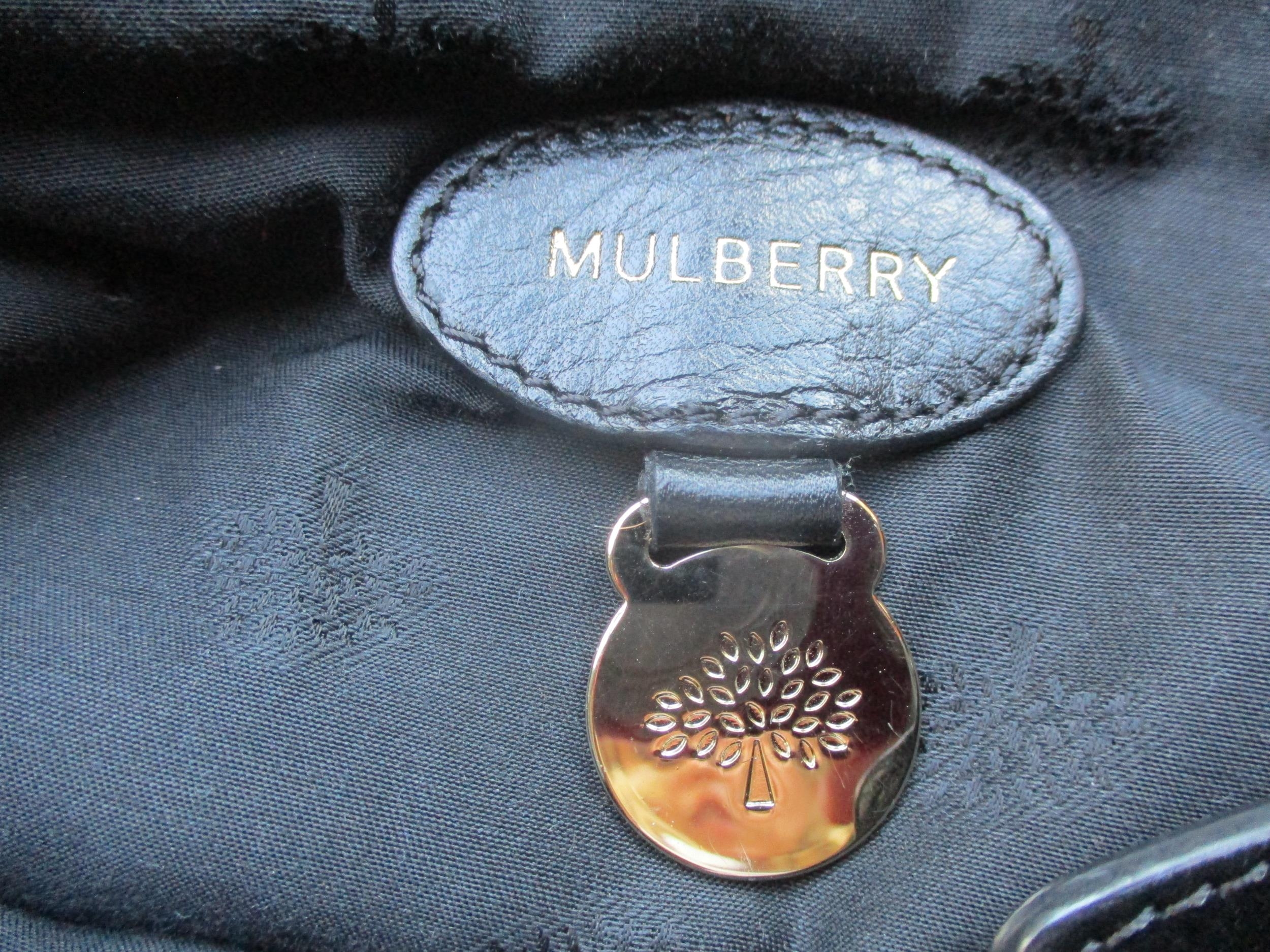 A Mulberry 2011 black leather postman's satchel style bag with gold tone hardware, serial number - Image 7 of 11