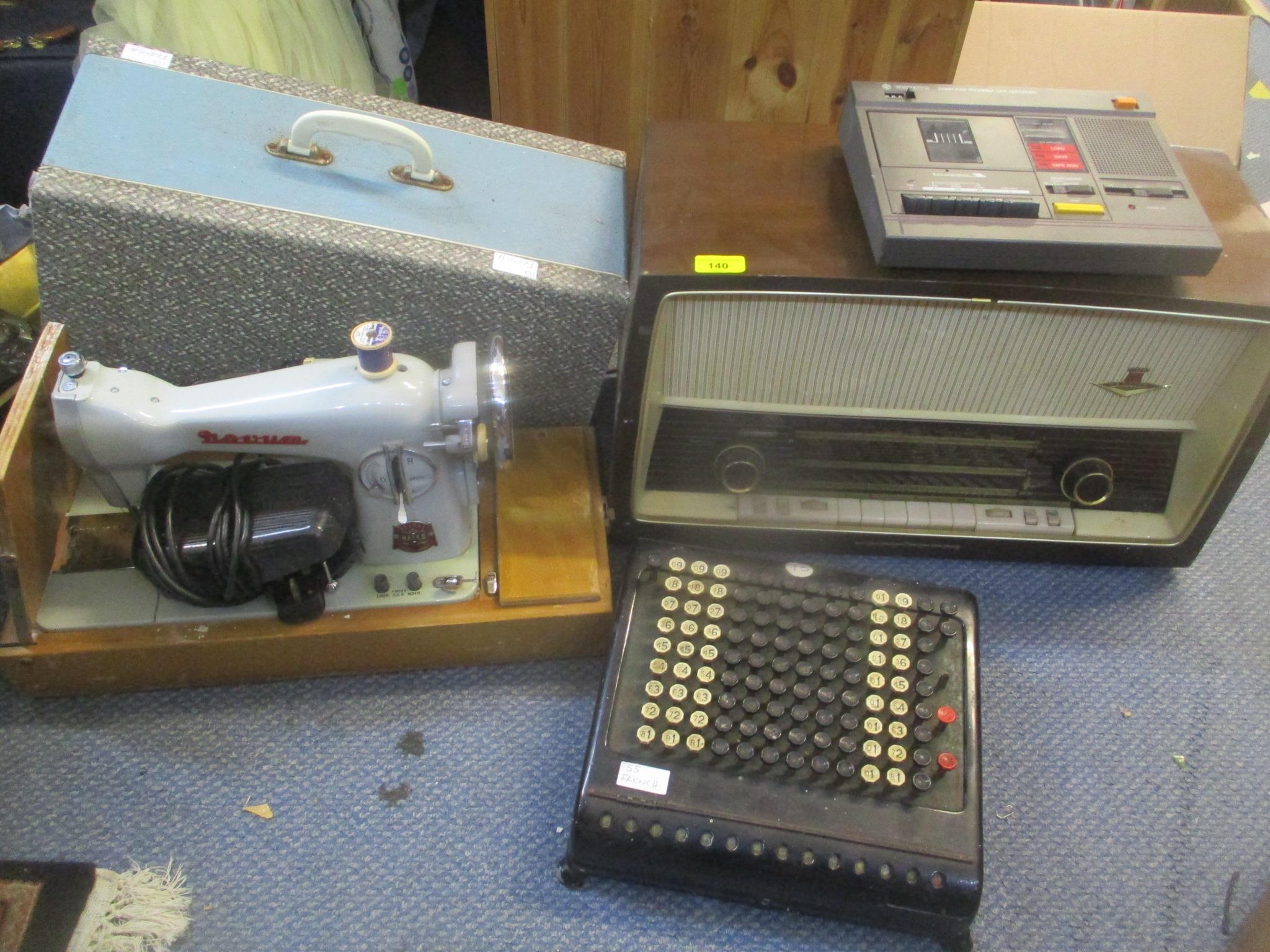 A Burroughs adding machine together with a Nord Mede radio, a Novum sewing machine and a WH Smith
