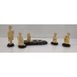 Early 20th century Japanese ivory to include a four piece band and a Chinese figure All items have