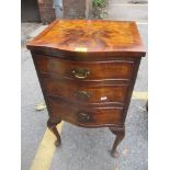 An early 20th century walnut veneered serpentine fronted bedside chest of three drawers, 73.5 h x