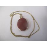 Yellow gold mounted large oval red agate pendant