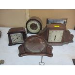 A group of 1930's to 1950's walnut, oak and mahogany cased mantel clock to include a Kendall and