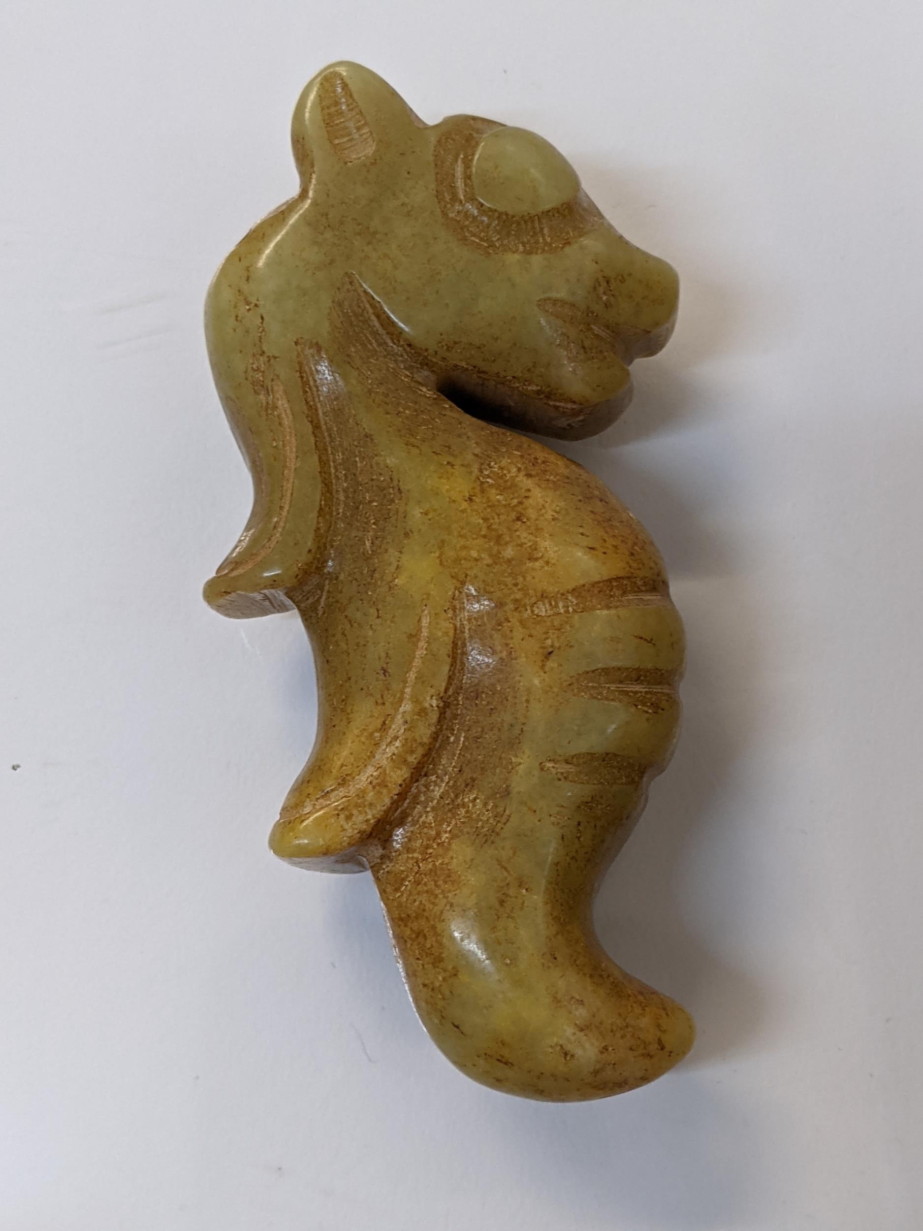 Five Chinese green/brown jade coloured pendants in the form of animals, a figure and others - Image 2 of 4