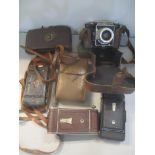 Mixed cameras to include a Contessa Nettel Agiflex and others in a brown leather bag