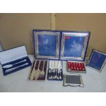A silver photograph frame, silver plated photograph frames, silver plated spoons and serving sets