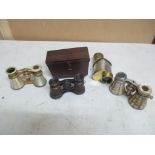 A brass and silver coloured metal monocular, stamped marks to one end, and three opera glasses,