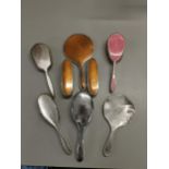 Eight silver dressing table brushes and mirrors Location: Port