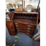 A Georgian mahogany bureau with original brass handles A/F 106cm h x 90cm w x 51cm d Location: LAM