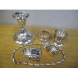 Silver to include a candlestick, napkin ring, salt and pepper pots, decanter label, necklace and egg