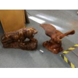 Two soft wood carvings of a tiger and an eagle Location: