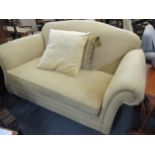 A modern Marks and Spencer's gold coloured chenille two seater sofa on mahogany stained legs on