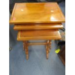 A reproduction yew nest of three tables Location: CL