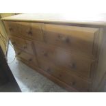 A modern pine chest of seven drawers, on a plinth, 80cm h x 151cm w