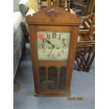 An early 20th century oak cased wall clock, and a 1930s mantel clock