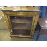 A late Victorian walnut pier cabinet having marquetry inlaid and two fitted loose shelves 105.5cm
