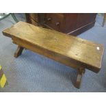 A Jack Grimble Cromer oak stool on shaped ends, 27cm h x 74cm w