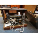A Singer sewing machine with travel case Location: LAM
