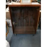 A vintage rosewood veneered cabinet with sliding glass doors 107cm h x 76cm w x 37cm d Location: A2