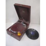 An His Masters Voice table top gramophone in a red case with records