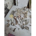 A selection of silver and silver plated cutlery and other items to include a silver egg cup,