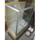An ex John Lewis display cabinet with two sliding doors 135cm h x 92.5cm w
