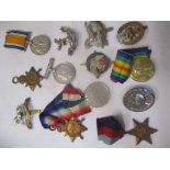 World War I and II medals, and cap badges to include