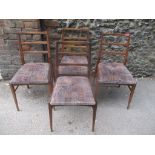 A set of four retro teak framed dining chairs, possibly by Richard Hornby for Heals
