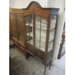 An Edwardian inlaid mahogany display cabinet with twin glazed doors, on slender legs, 184cm h x 90cm