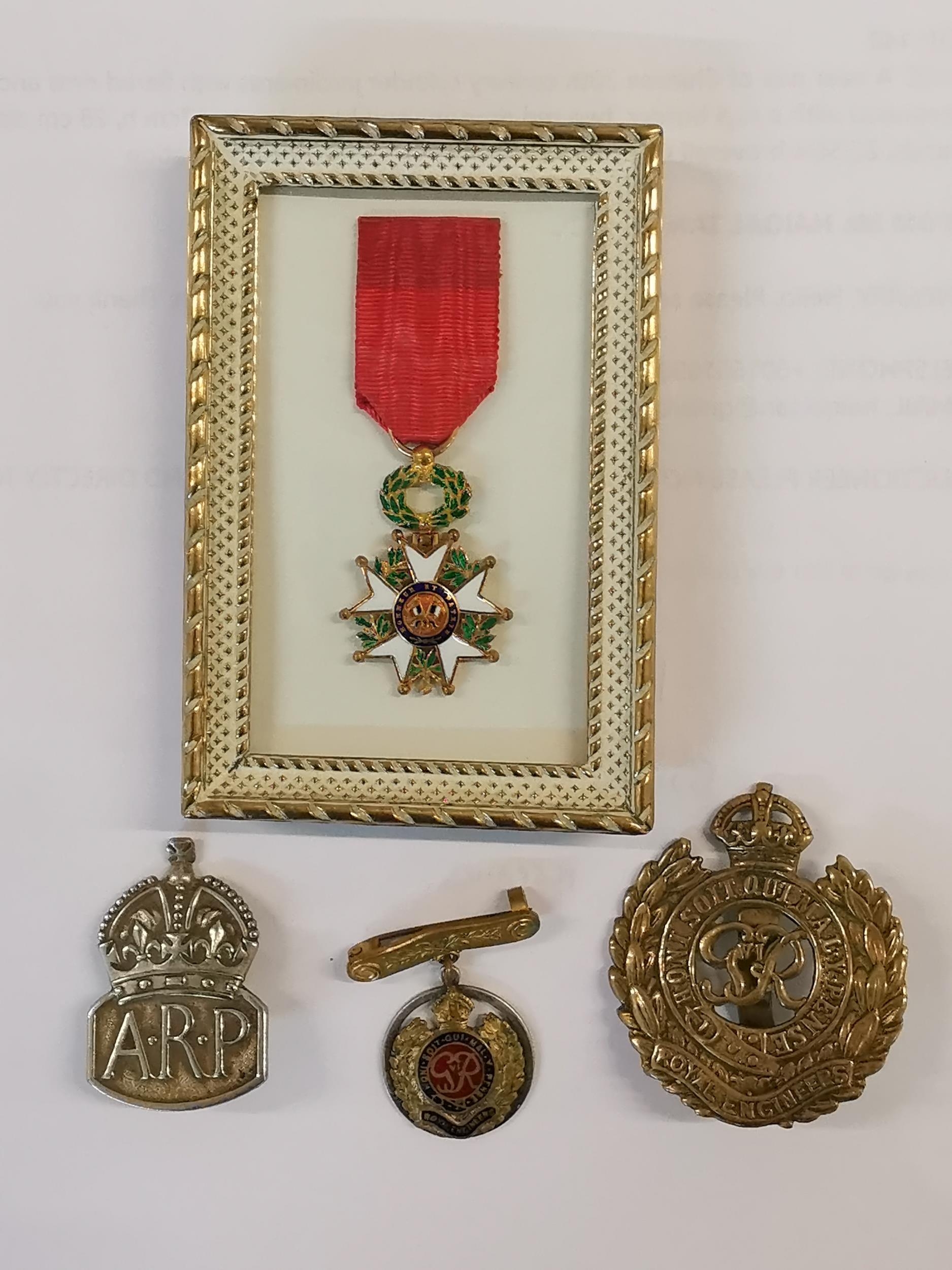 A French miniature medal of Honour together with two Royal engineers badges and an Air Raid